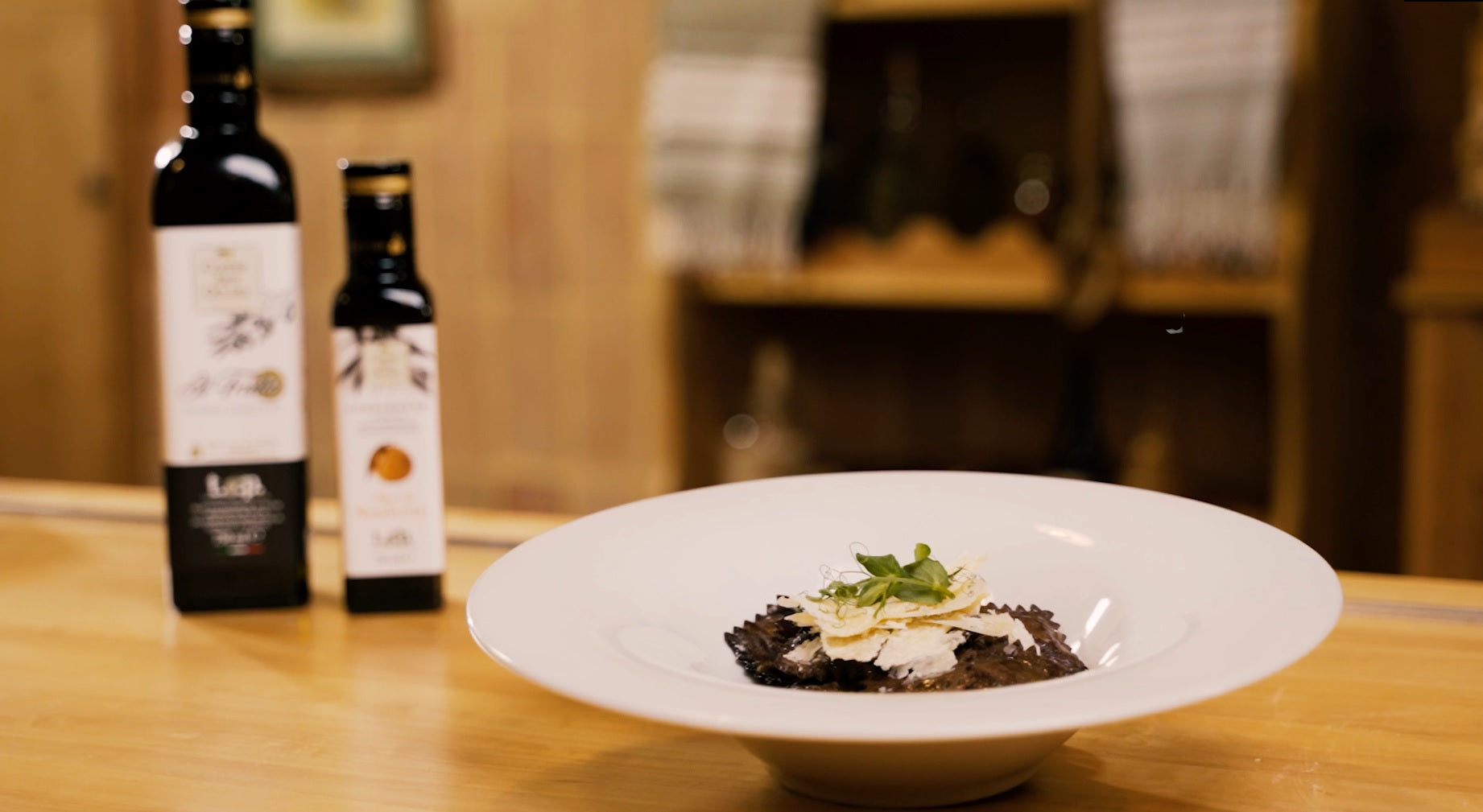 Ravioli al cioccolato ripieni di zucca con olio al mandarino Coppini Arte Olearia